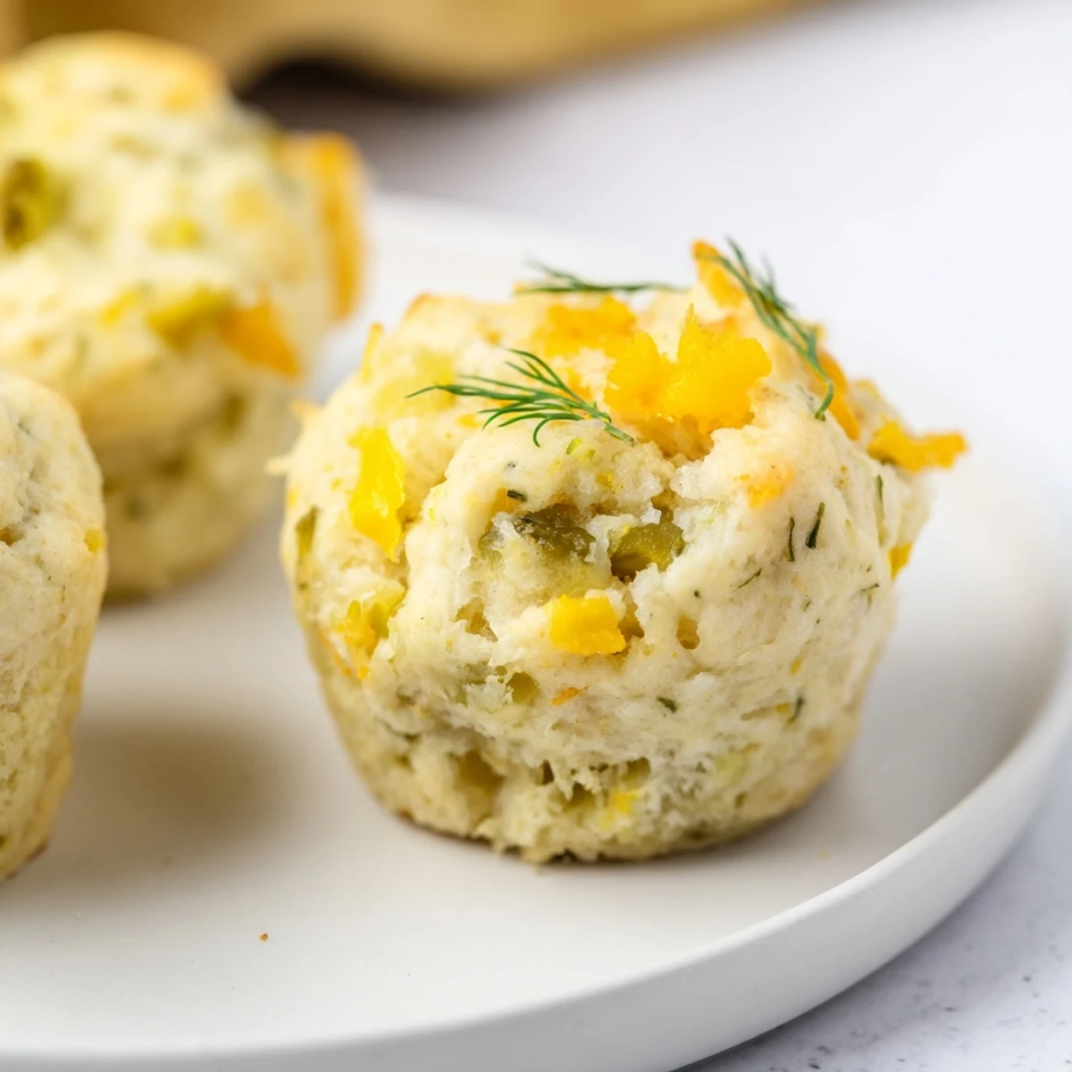 Tender biscuits packed with dill pickles and spicy jalapeños, a unique snack idea.  