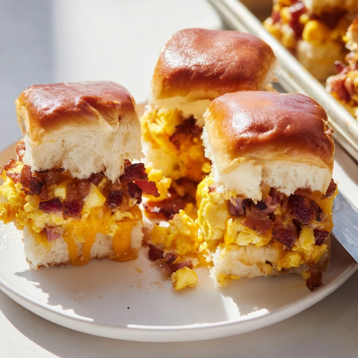 Savory Crack Breakfast Sliders topped with ranch butter, ideal for brunch gatherings.  