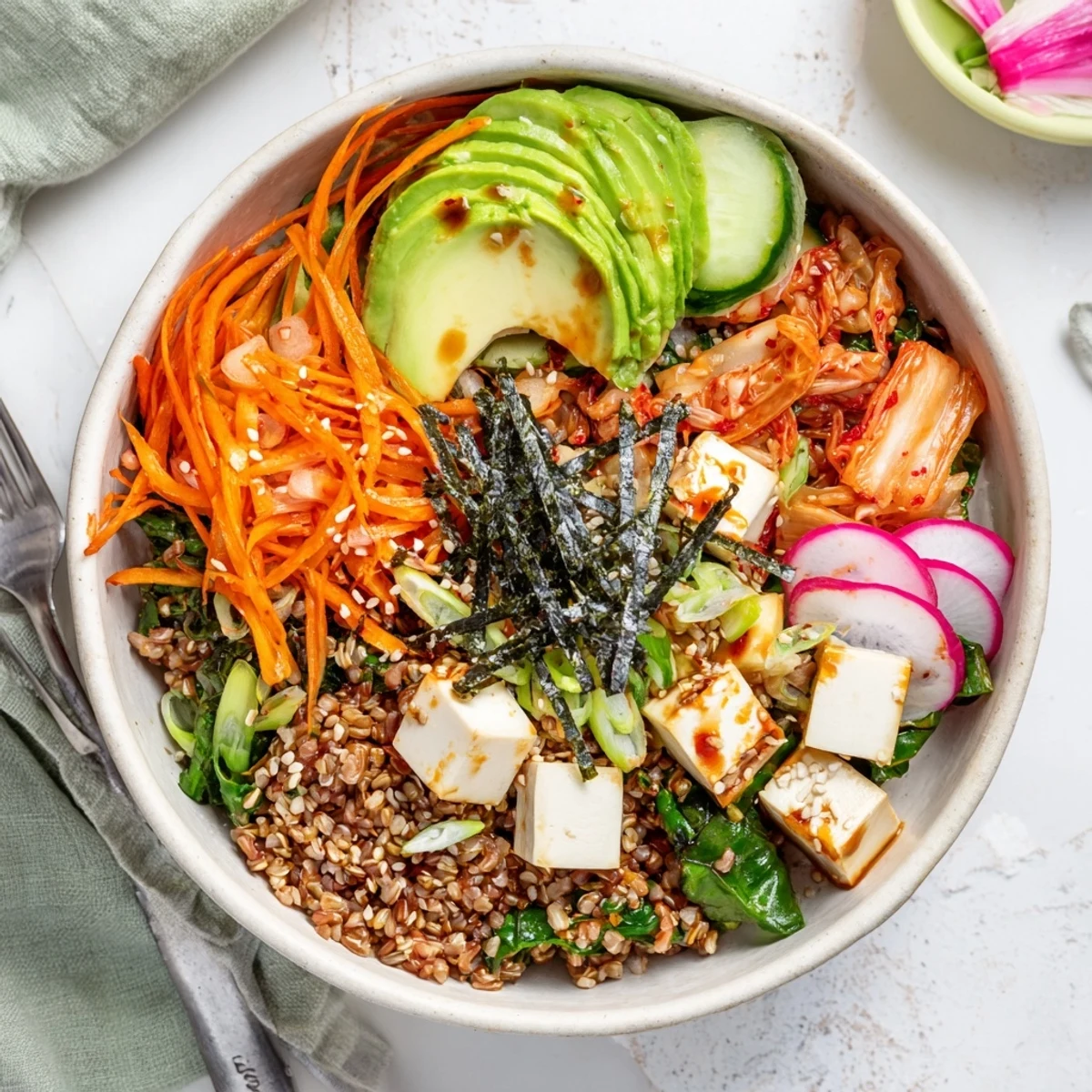Vibrant fermented vegetable bowl with kimchi, fresh veggies, and hearty grains.  