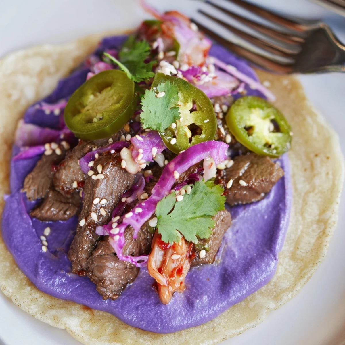 Savory Korean-inspired bulgogi filling in vibrant Fusion Tacos bursting with flavor.  
