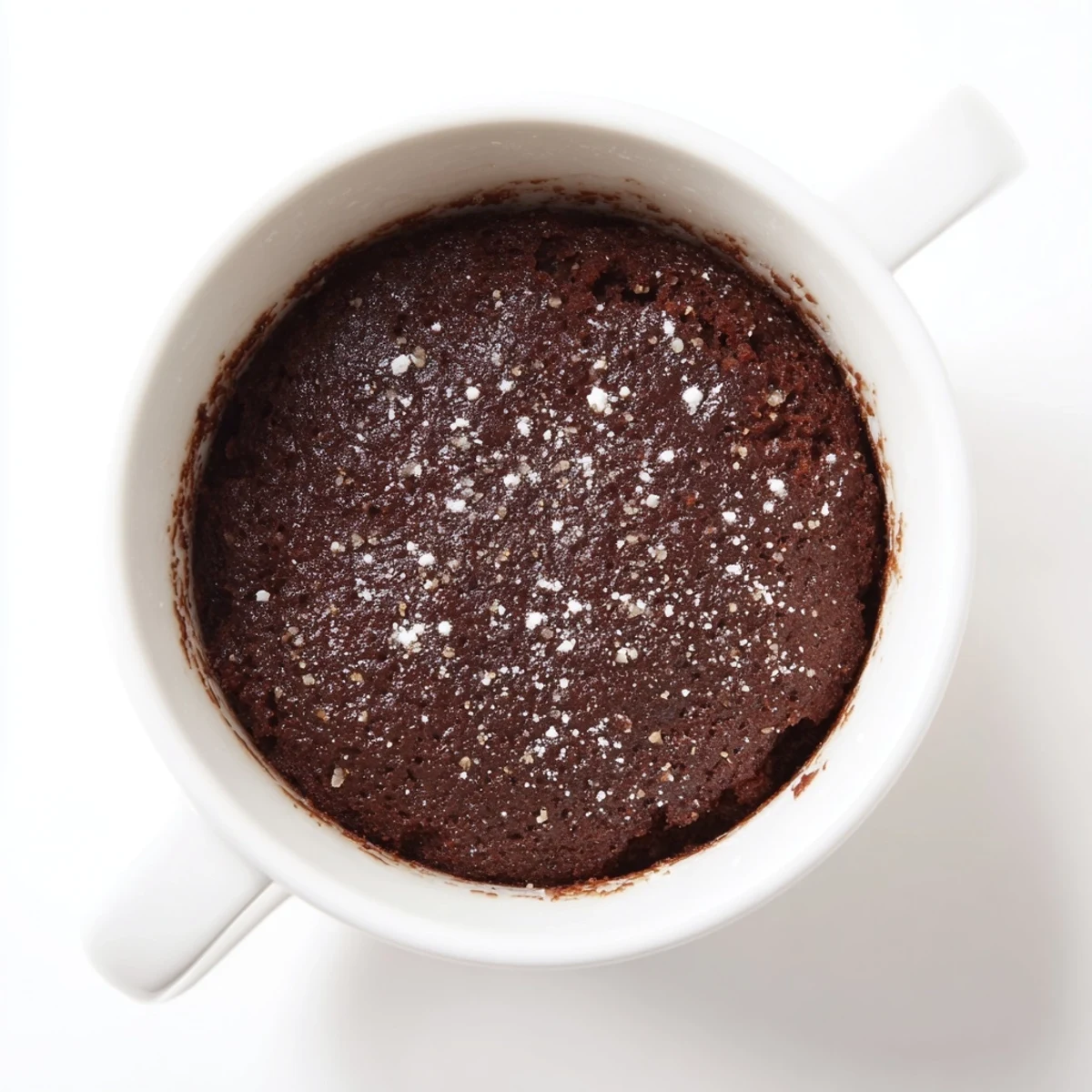 Fluffy microwave mug cake, ready to eat in a mug, perfect for a quick & delightful dessert.
