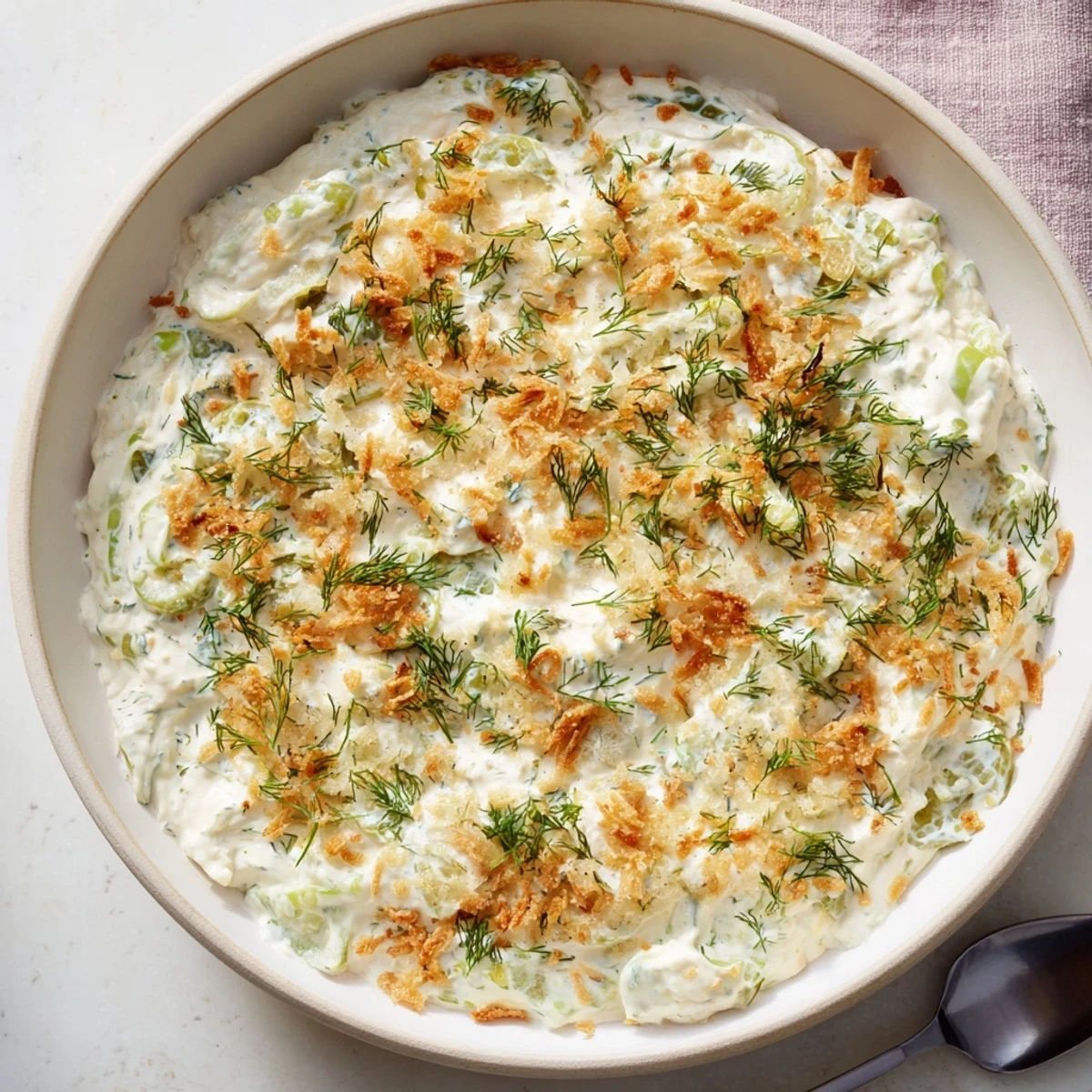 Creamy Fried Pickle Dip, ready to serve with crispy chips, a perfect savory appetizer.