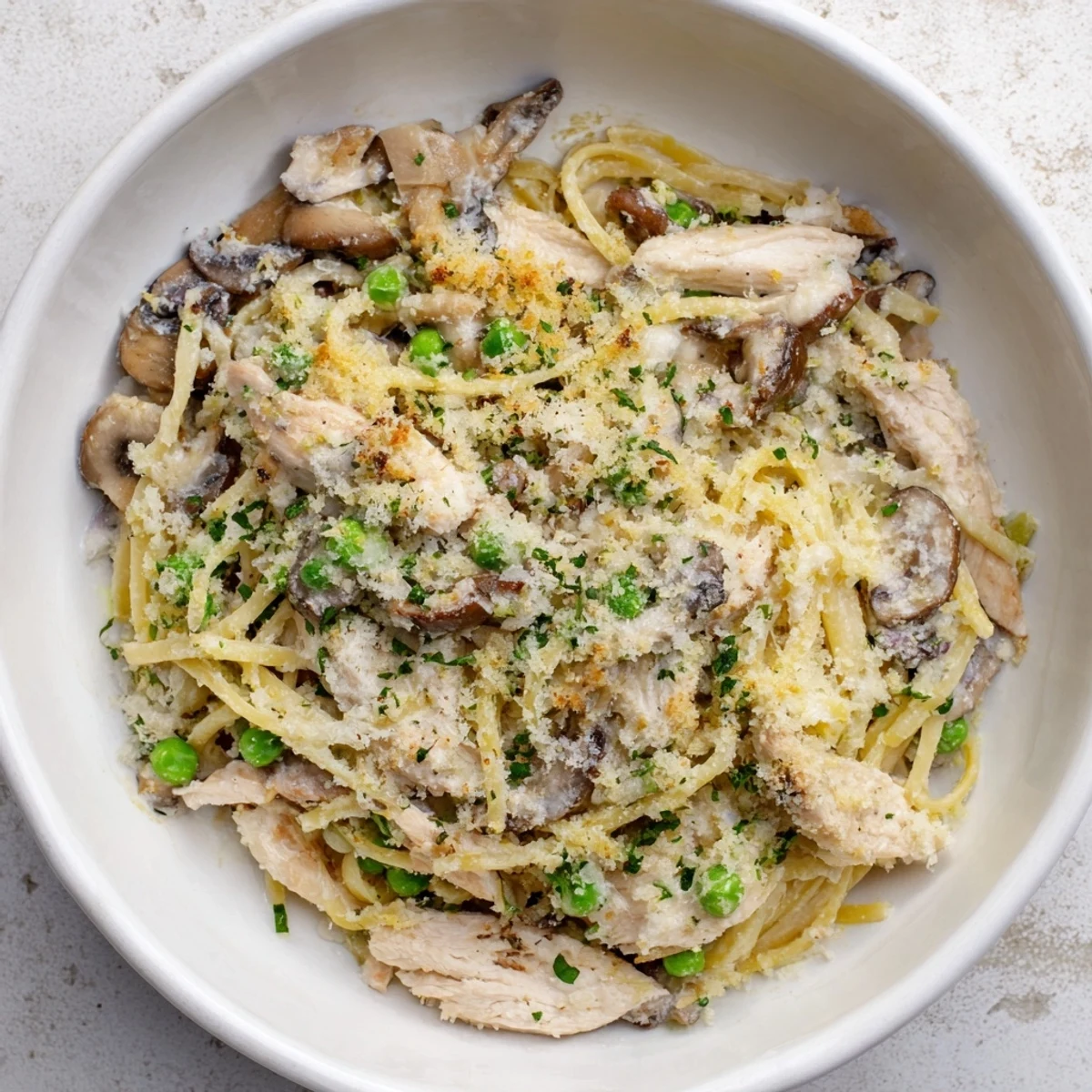 Golden, bubbly Turkey Tetrazzini with a crunchy panko topping, perfect for a cozy dinner.