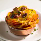 Warm Copper Penny Warmth with melted cheese and toasted pecans, ready for a comforting bite.