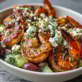 Colorful Greek Shrimp Bowl featuring juicy tomatoes, crisp cucumber, and tender grilled shrimp, ready for a quick weeknight dinner.