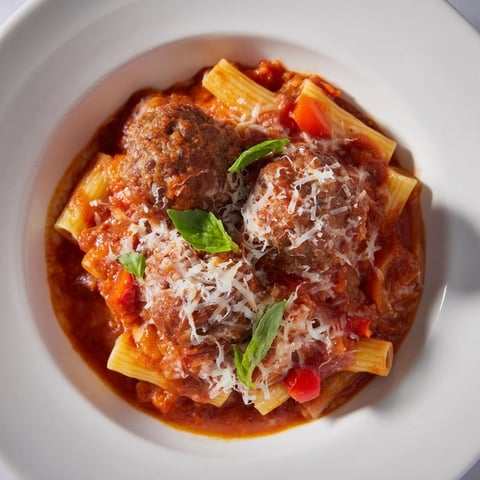Italian Meatball Pasta Skillet: A bubbling one-pan meal with melted cheese and savory meatballs.