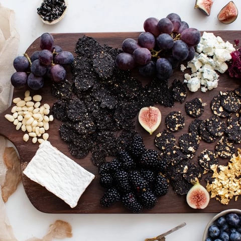 Deep Indigo Midnight Sky cheese board, visually stunning with blackberries and star-like goat cheese.