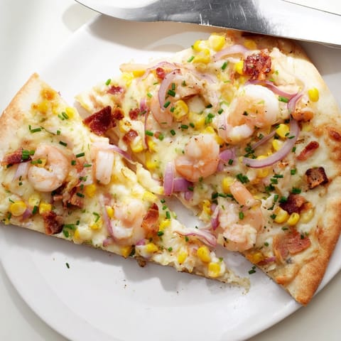 Creamy Shrimp Corn Chowder Flatbread: Crispy crust topped with sweet corn and smoky bacon.