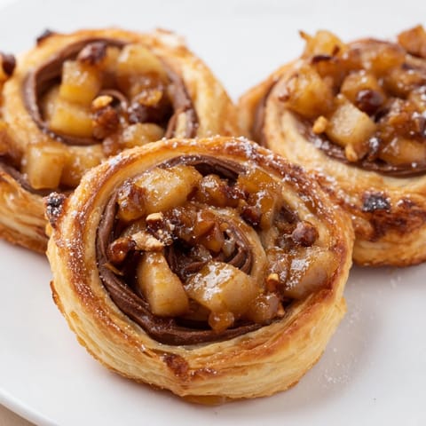 Deliciously sweet Caramel Apple Nutella Pinwheels perfect for breakfast or dessert enjoyment.  