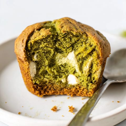 Deliciously tender matcha white chocolate pumpkin muffins topped with creamy chocolate chips.  