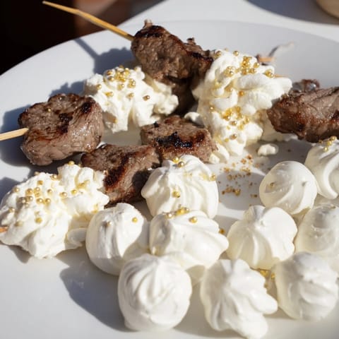 This Fluffy Clouds Lamb Baby Shower Board features savory lamb next to creamy cheese clouds, perfect for an event.