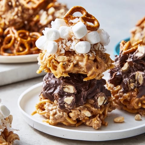 Dazzling view of stacked haystack candy, featuring butterscotch, pretzels, and white chocolate.