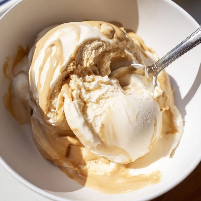 This Peanut Butter Banana Ice Cream features perfectly blended frozen bananas, with a rich peanut butter swirl for enjoyment.