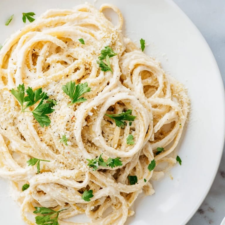 Golden-brown Pasta Alfredo Cottage Hack, where tender pasta meets a delightful cottage cheese sauce.