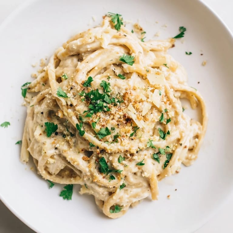 A steaming bowl of High-Protein Mac & Cheese, rich with cheddar and parmesan, perfect for dinner.